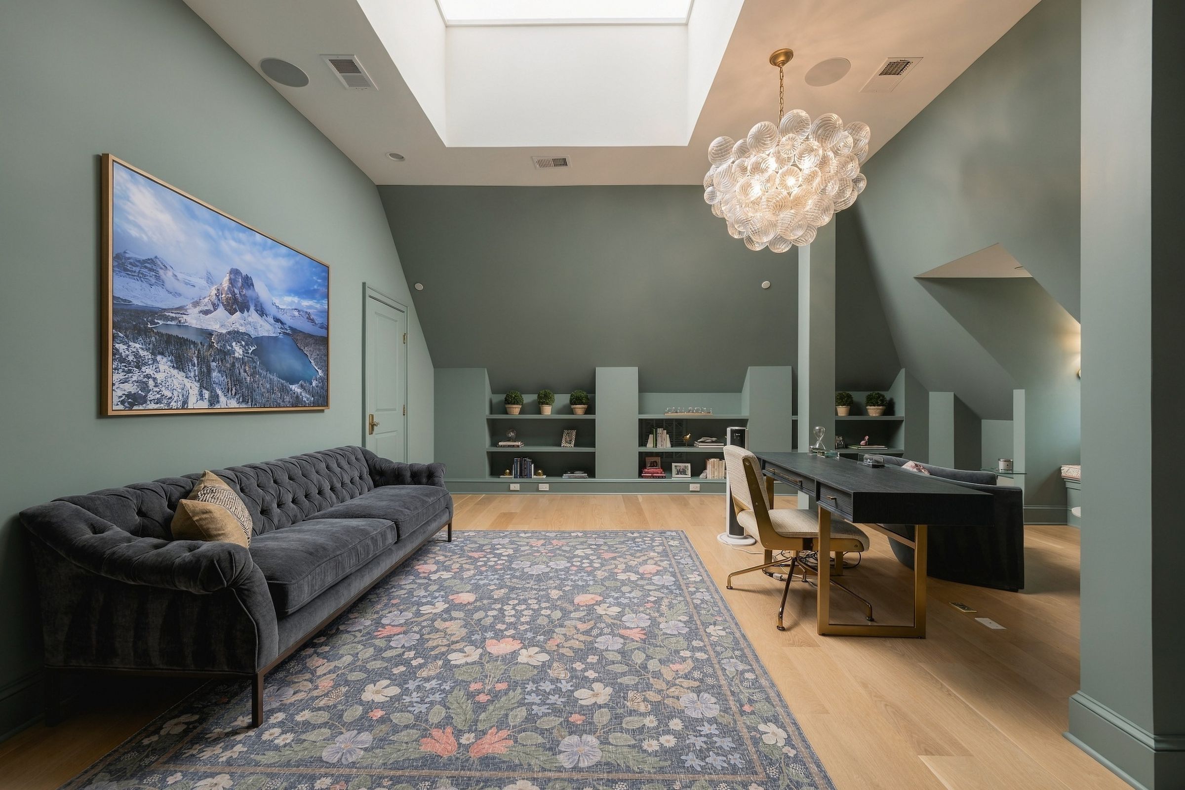 Skylit third-floor suite lined with built-ins