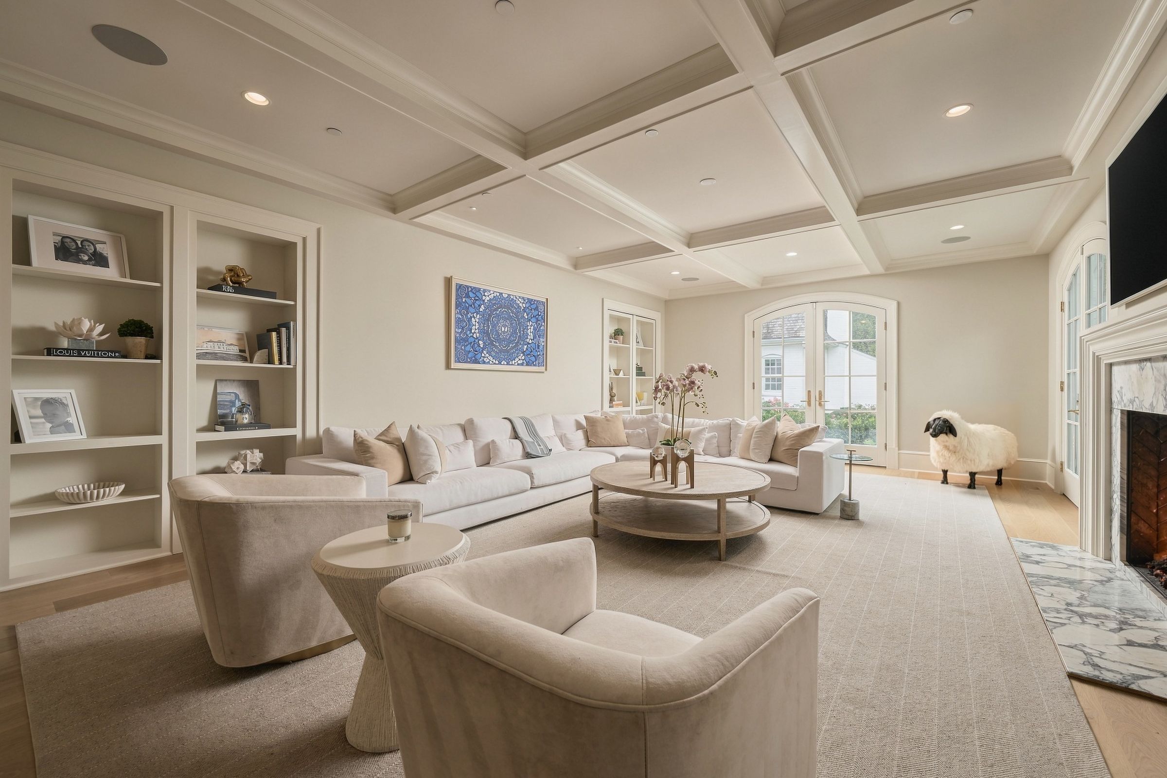 Family room beneath a coffered ceiling