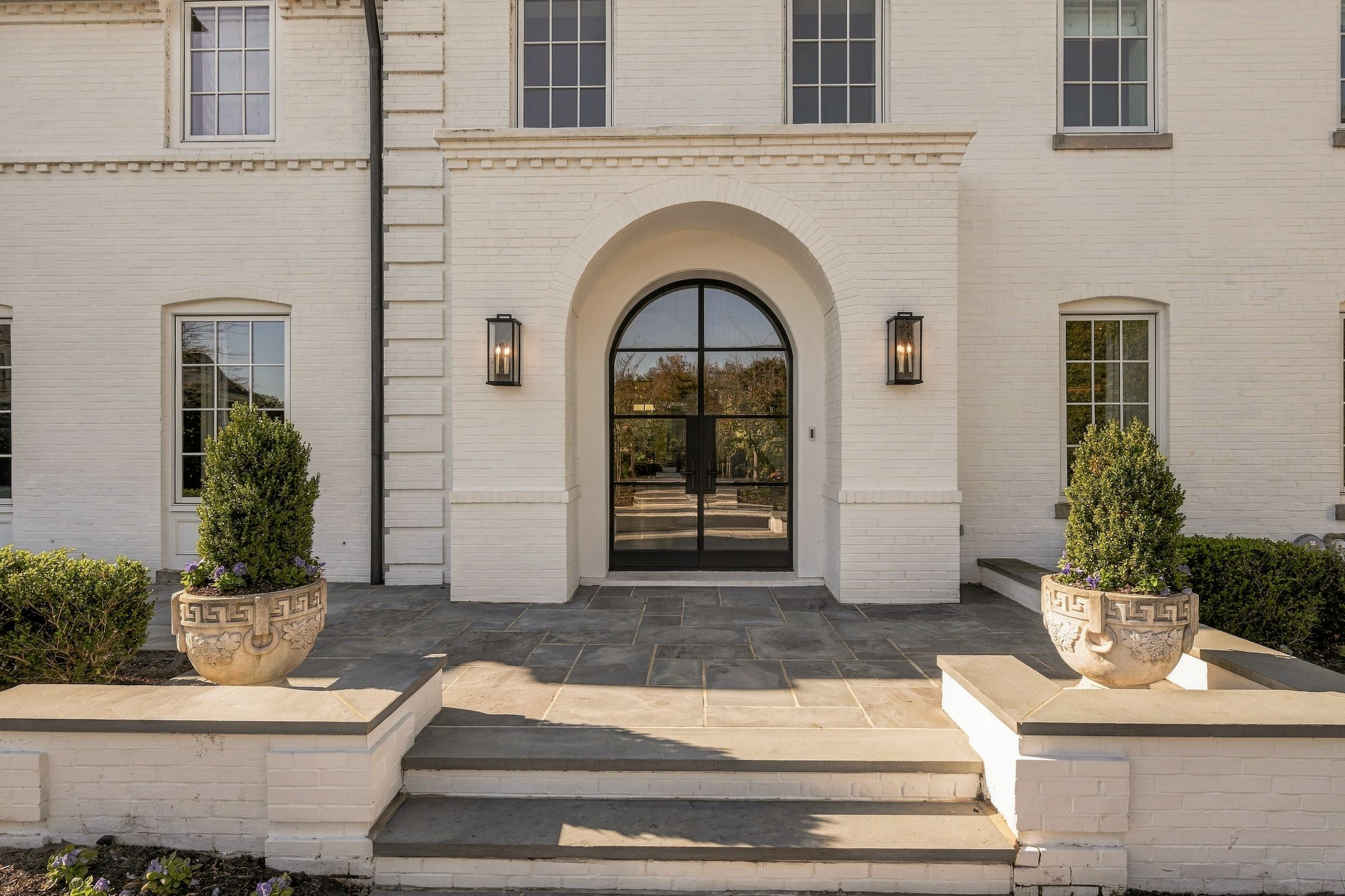 Arched steel-and-glass front door
